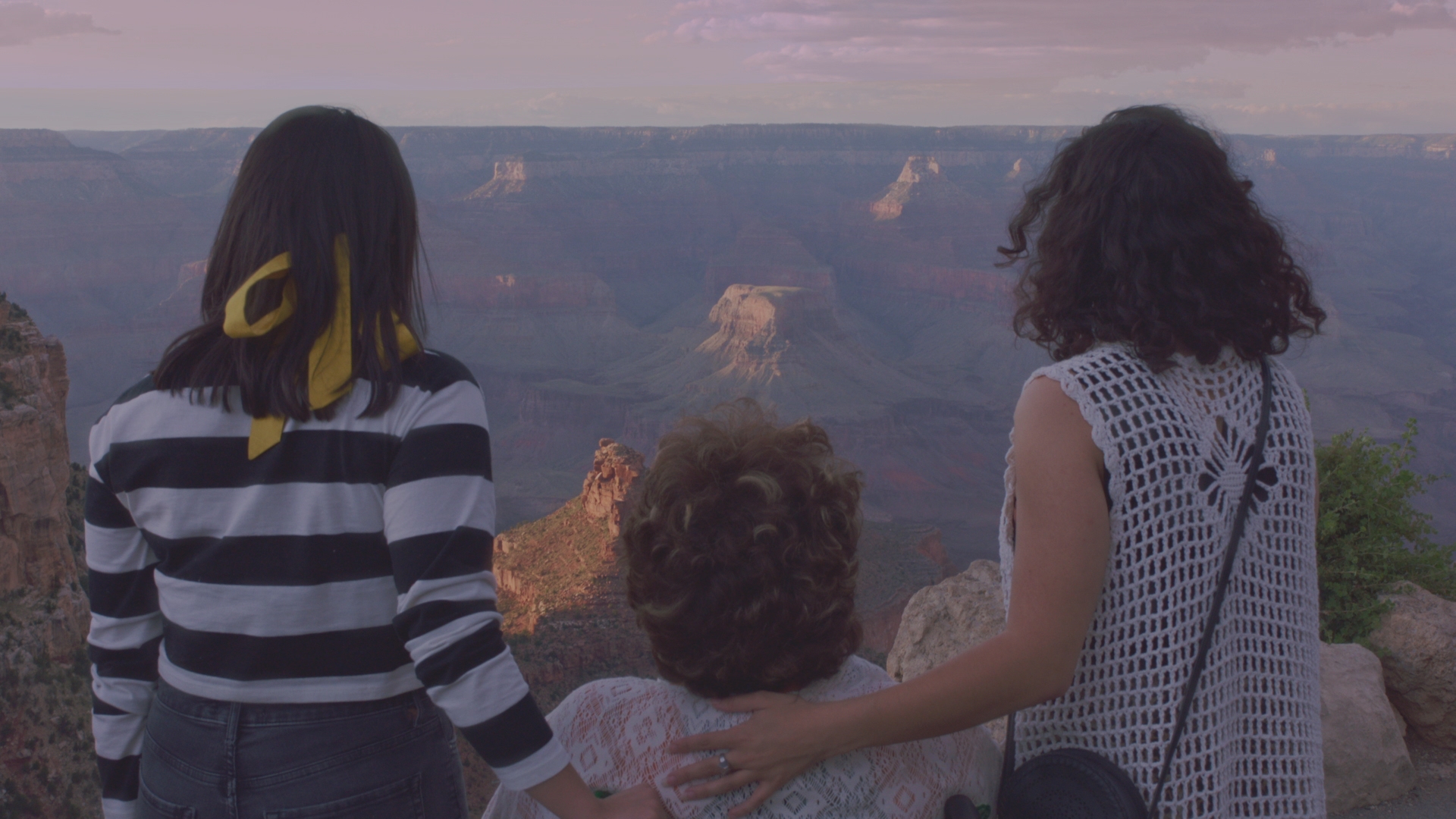 Marina, Juana, and Karina look out at the Grand Canyon.