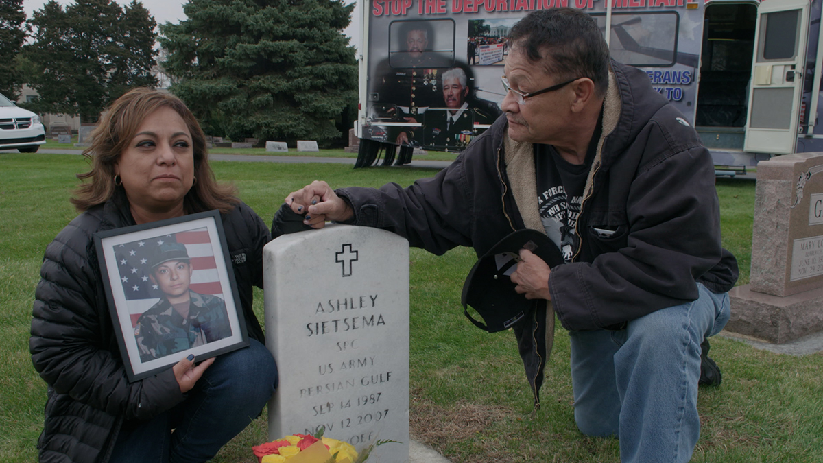Olivia Segura and Manuel at her daughter's grave